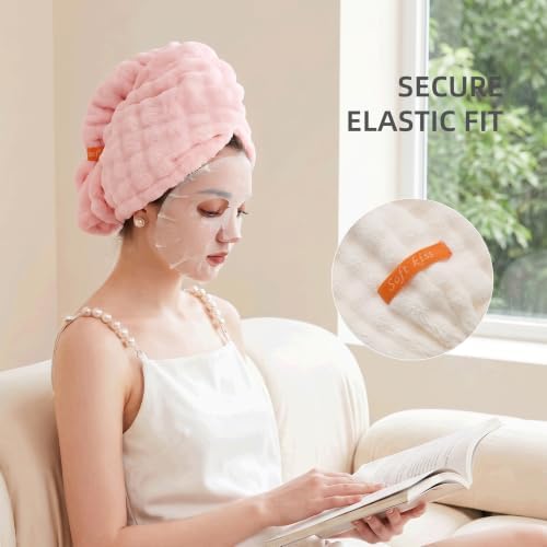 Two Hair Drying Towels, one Sky Blue and the Other Rose Pink.